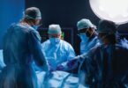 Surgeons performing complex procedure in an operating room, illustrating advanced surgical technology integration.