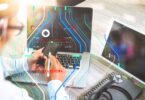 Doctor using smartphone and laptop with digital health interface overlay, representing continuous glucose monitoring technology