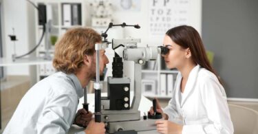 Ophthalmologist examining a patient’s eye during a clinical check-up, representing advances in ophthalmic drug delivery
