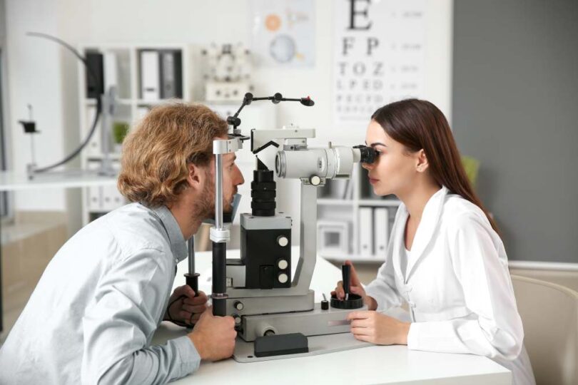Ophthalmologist examining a patient’s eye during a clinical check-up, representing advances in ophthalmic drug delivery