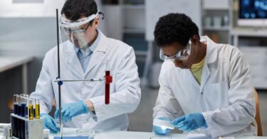 Scientists conducting cancer immunotherapy research in a laboratory, representing epcoritamab studies in diffuse large B-cell lymphoma (DLBCL).