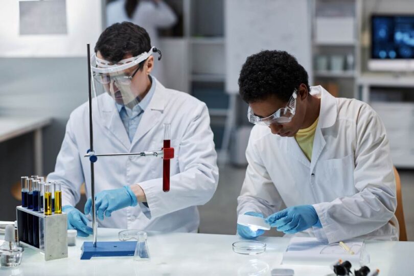 Scientists conducting cancer immunotherapy research in a laboratory, representing epcoritamab studies in diffuse large B-cell lymphoma (DLBCL).