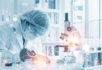 Scientist using AI-driven software for drug discovery in a biotechnology lab