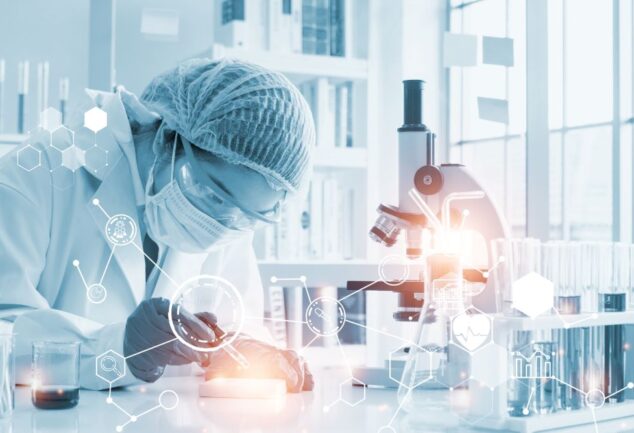 Scientist using AI-driven software for drug discovery in a biotechnology lab
