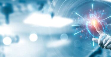 Clinician interacting with digital data visualisation of a human heart symbolising AI-enabled clinical research.