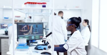 Laboratory scientist analysing clinical trial data on a digital analytics platform