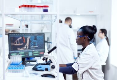 Laboratory scientist analysing clinical trial data on a digital analytics platform
