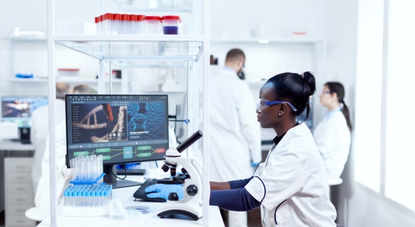 Laboratory scientist analysing clinical trial data on a digital analytics platform