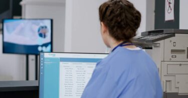 Hologic AI mammography technology assisting radiologist reviewing breast imaging results