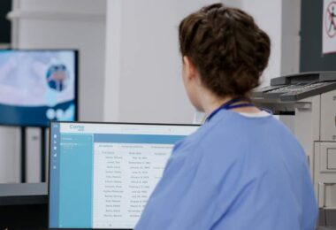 Hologic AI mammography technology assisting radiologist reviewing breast imaging results