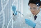 Scientist using a pipette with digital DNA and health data graphics
