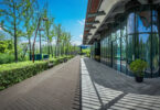 Modern business buildings surrounded by greenery in an outdoor park setting
