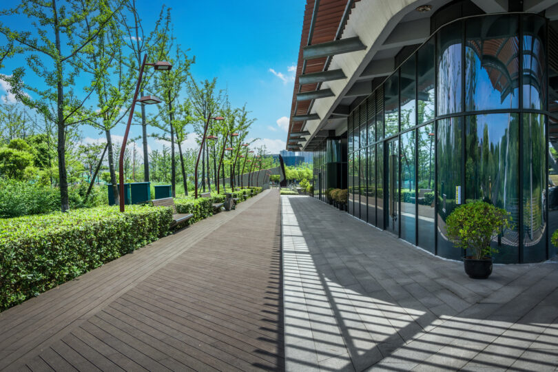 Modern business buildings surrounded by greenery in an outdoor park setting